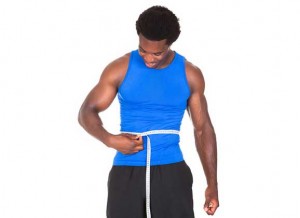 man measuring waist